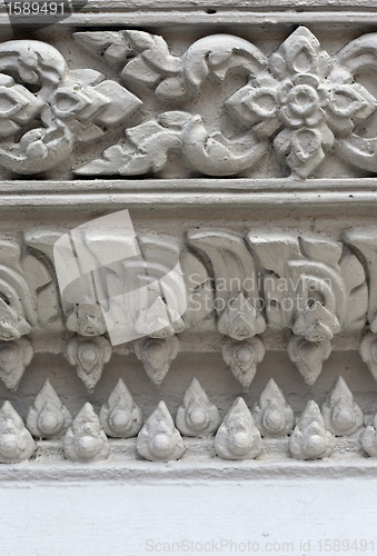 Image of White stucco , thai style on the Wall