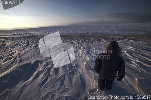 Image of walking boy in snow