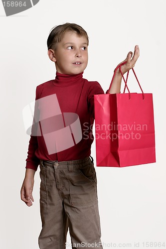 Image of Child with a red gift bag