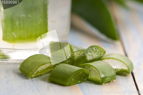 Image of aloe vera juice with fresh leaves