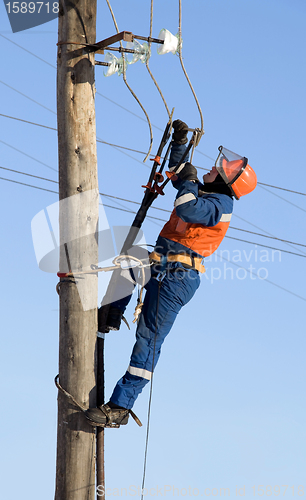 Image of Electrician working at height