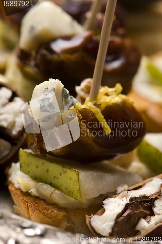 Image of Appetizer Plate with Dactyl, Pecan nuts and Cheese