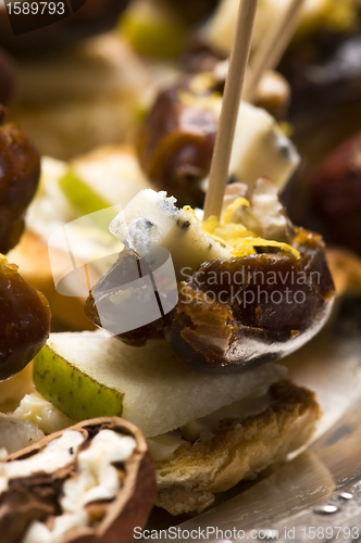 Image of Appetizer Plate with Dactyl, Pecan nuts and Cheese