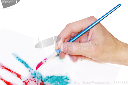 Image of Hand painting picture with brush artist