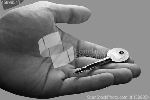Image of Man holding key in his hand