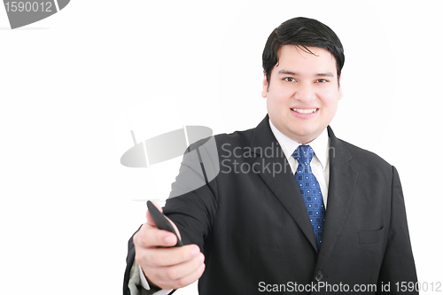 Image of Handsome young man in a suit giving you a mobile