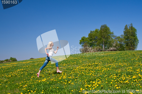 Image of happy young woman on meadow