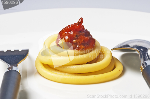 Image of macaroni with tomato sauce