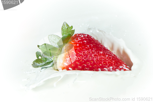 Image of strawberry splashing into milk