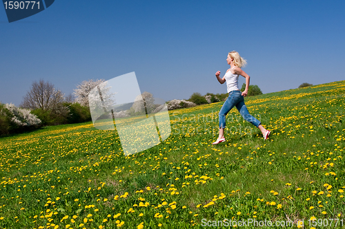 Image of happy young woman on meadow
