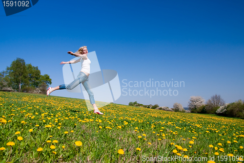 Image of happy young woman on meadow