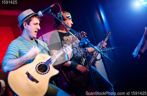 Image of musician plays a guitar