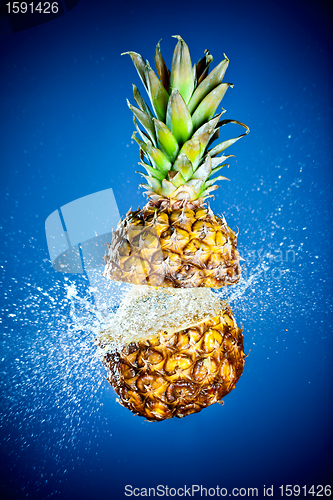 Image of Pineapple splashed with water