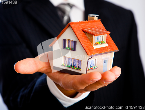 Image of house in a hand