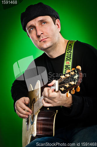 Image of man with a guitar