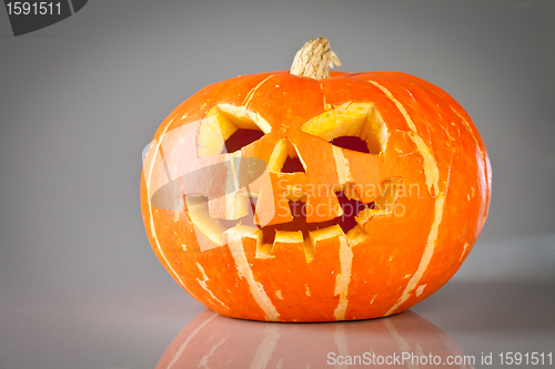 Image of halloween, old jack-o-lantern on grey