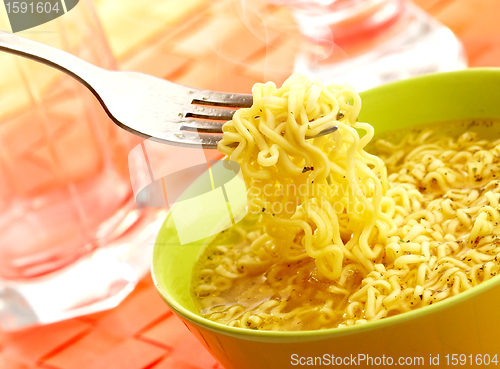 Image of Hot and tasty noodles on a plug.