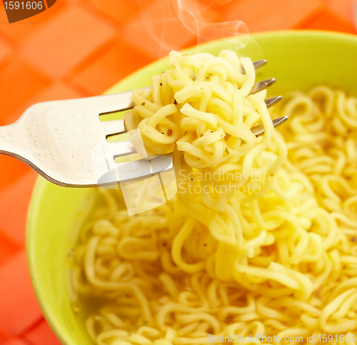 Image of Hot and tasty noodles on a plug.