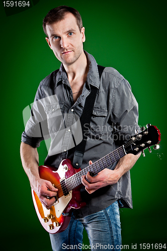 Image of man with a guitar