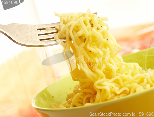 Image of Hot and tasty noodles on a plug.