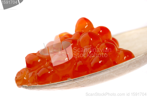 Image of Red caviar on the spoon, on a white background 