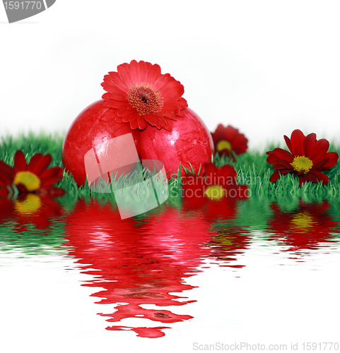 Image of Red Easter eggs and red flowers