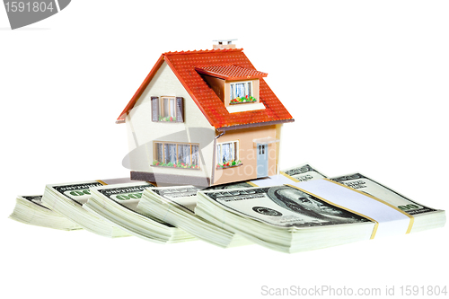 Image of house on packs of banknotes