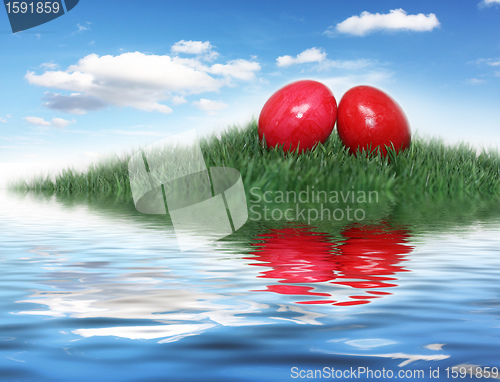 Image of Red Easter eggs on a small hill