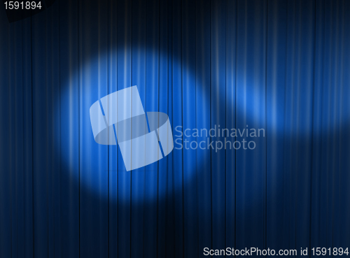 Image of blue spotlight in the theater