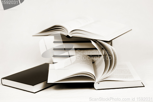 Image of composition of bw books toned to sepia