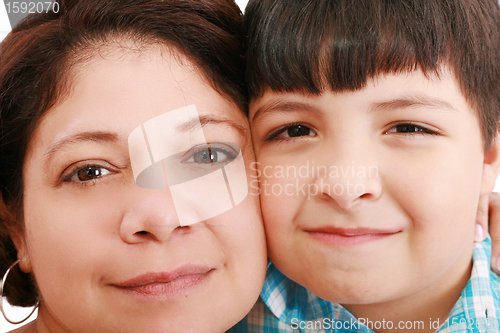 Image of Close-up portrait of a smiling young mother and little son