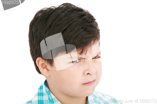 Image of Close-up portrait of angry little boy isolated on white backgrou