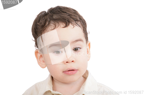 Image of little boy, child looking down isolated on white 