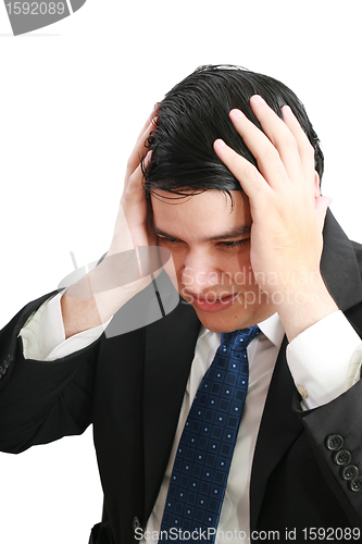 Image of Man frustrated with hands on his head. 
