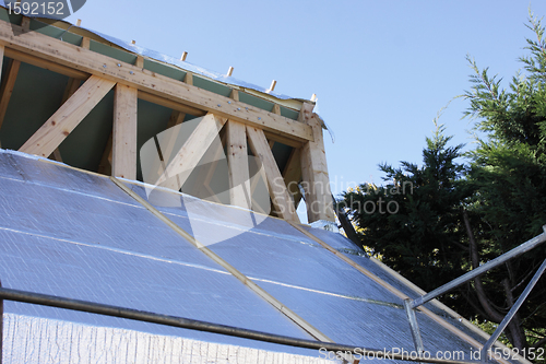 Image of construction of the wooden frame of a roof
