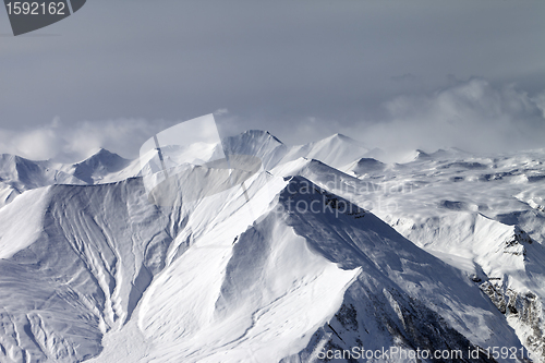 Image of Snowy mountains in haze