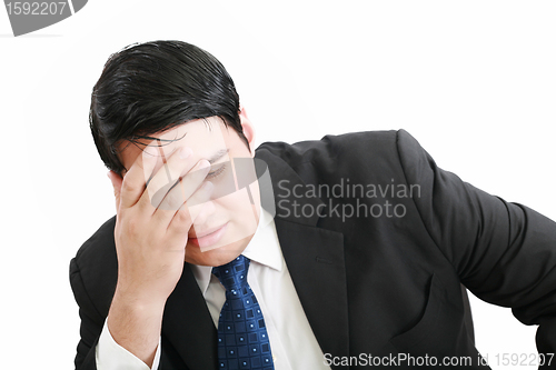 Image of Portrait of a young business man depressed from work against whi