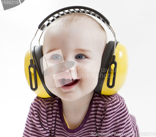 Image of young child with ear protector