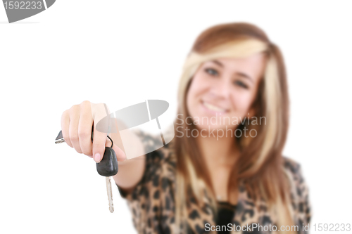 Image of Young caucasian woman holding car key. Image with shallow depth 