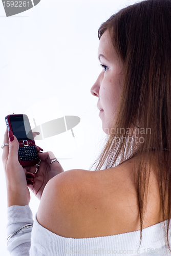 Image of Pretty woman talking by mobile phone