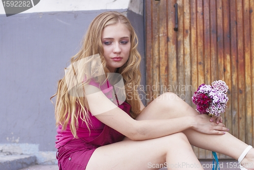 Image of Waiting girl with bouquet