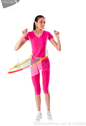 Image of Young attractive woman holding hula hoop