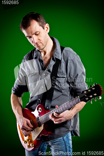 Image of man with a guitar