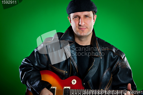 Image of man with a guitar