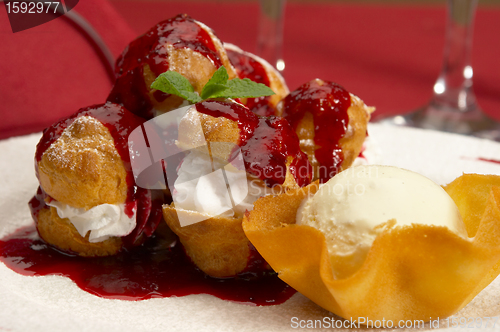 Image of Tasty profiteroles on a dining table