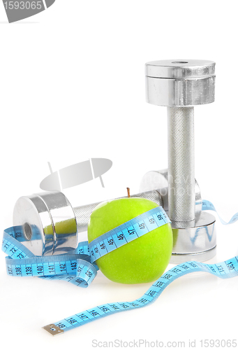 Image of Dumbbells and apple. A healthy way of life