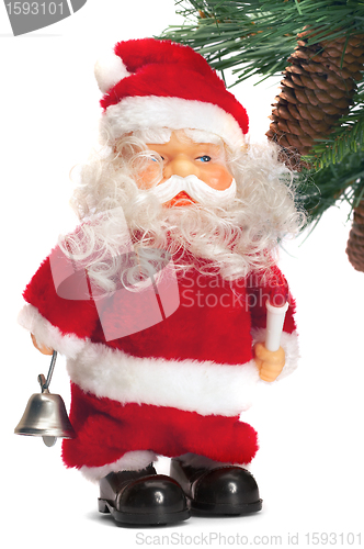 Image of santa with a handbell in hands near a fur-tree