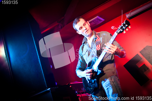 Image of musician plays a guitar