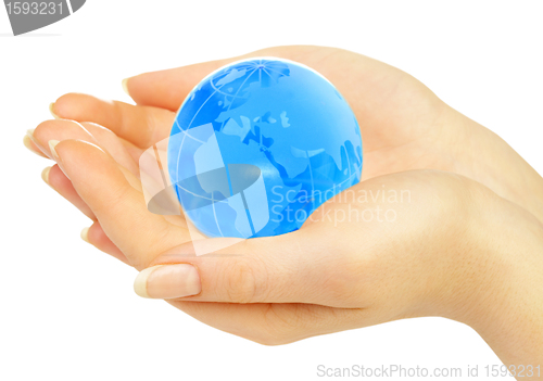 Image of hand of the person holds globe