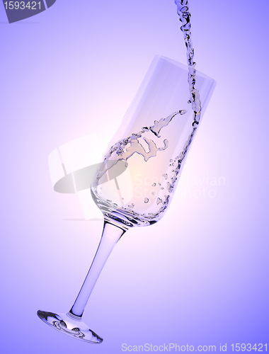 Image of White Wine being poured in a wine glass